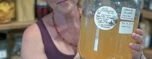 homemade apple cider vinegar in a large bottle