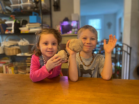 image of kids holding play dough