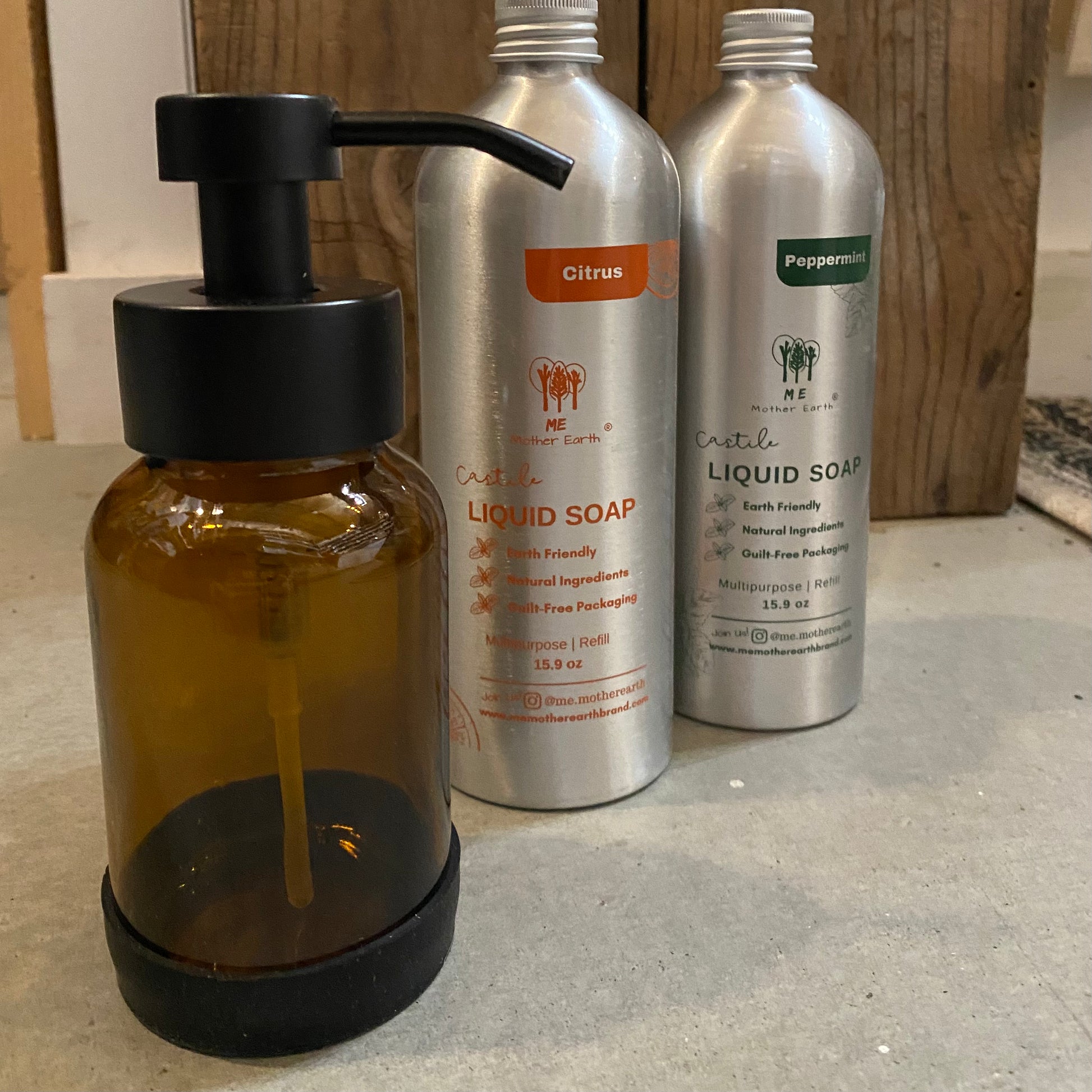 image of amber pump bottle and two bottles of liquid castile soap